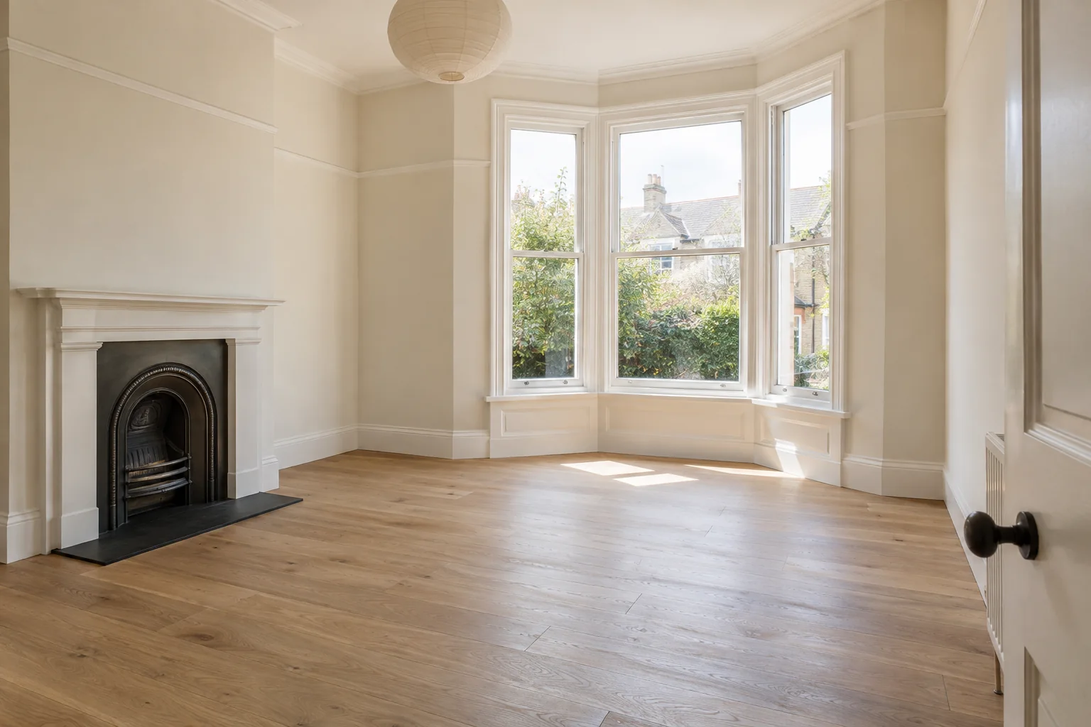Airy unfurnished bedroom with a bay window
